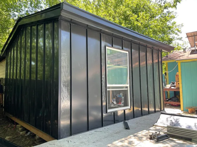 Black standing seam metal wall panels for Roof Inspection in Manor